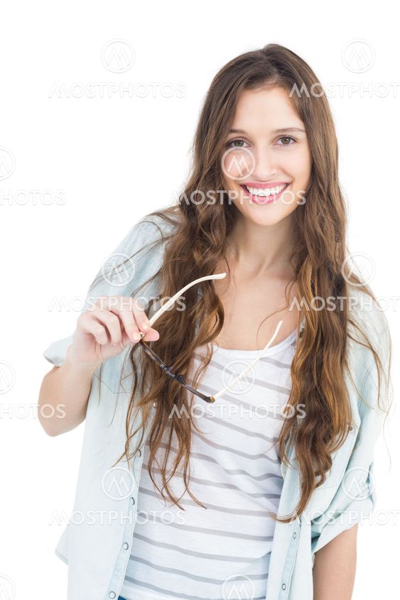 Portrait of female student holding eyeglasses