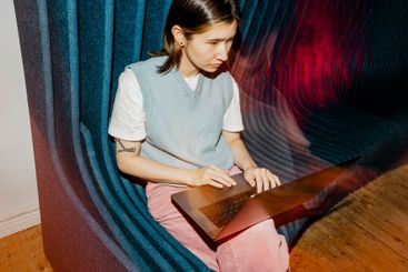 High angle view of female computer programmer using...