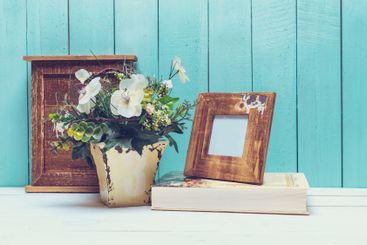 Shabby chic style home decorations on wooden background