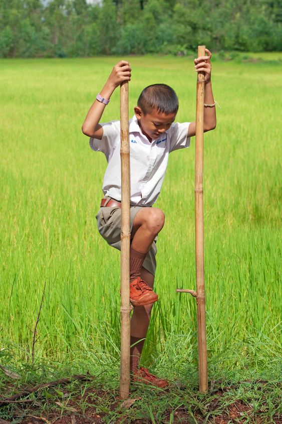 Boy goes on stilts