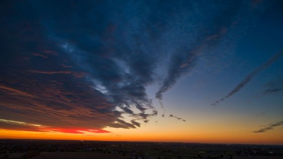 Aerial View of a Cloudy Red and Orange Sunset