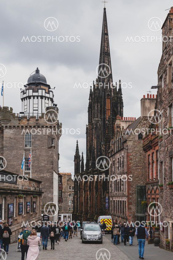 Edinburgh, Scotland - April 2018: Royal Mile, touristic street of Old Town Edinburgh City in Scotland, with Tron Kirk, former gothic church, now functioned as The Hub, a venue for various events and festivals