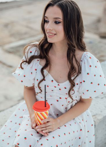 Beautiful fashionable brunette woman in summer dress...