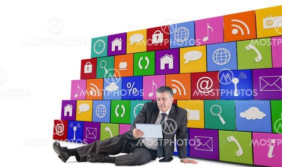 Composite image of mature businessman sitting using tablet