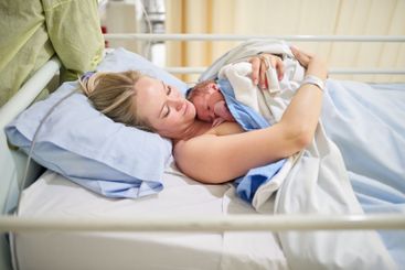Hospital, motherhood and woman with newborn, happy and...