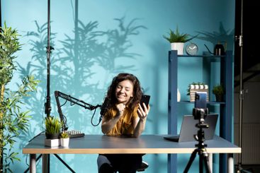 Ecstatic woman reacting to romantic text messages during...