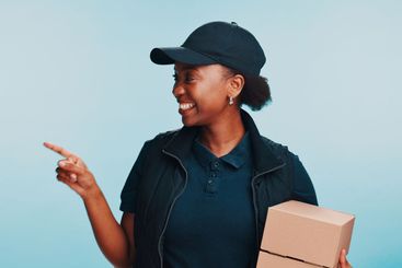 Smile, black woman and pointing to space with shipping,...