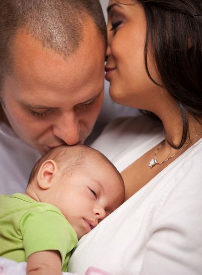 Mixed Race Young Family with Newborn Baby