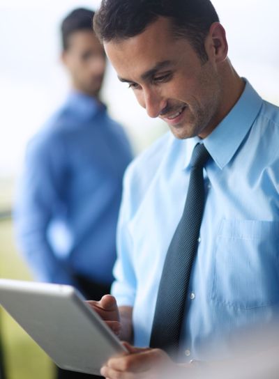business man using tablet compuer at office