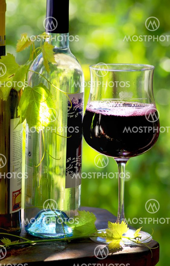 bottles and glass of red wine
