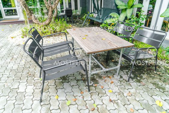 Tables and chairs in restaurant .