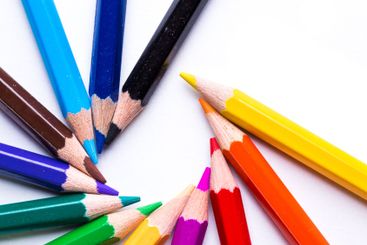 Collection of colorful pencils arranged in a creative...