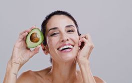 Laugh, skincare and portrait of woman with avocado for...