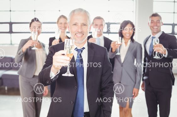 Portrait of businessman holding champagne flute