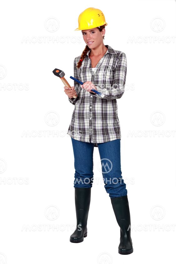 craftswoman holding a hammer and a wedge