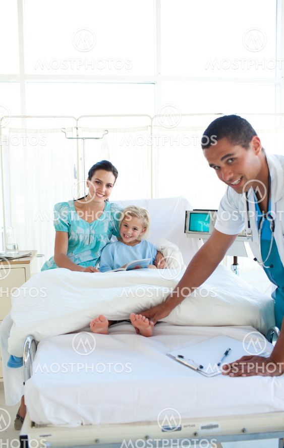 Attractive doctor examining little girl