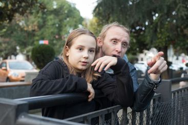 Cheerful daughter child girl and her father together...