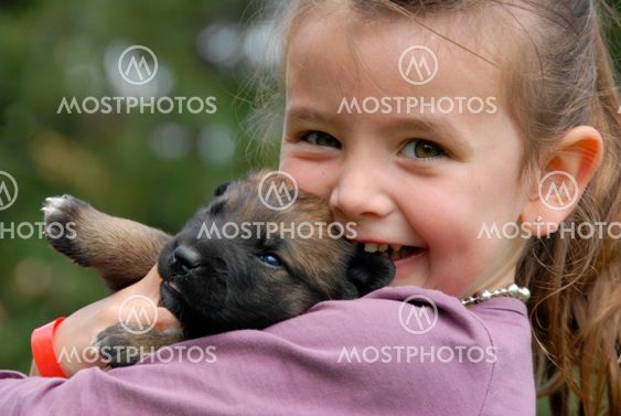 little girl and puppy