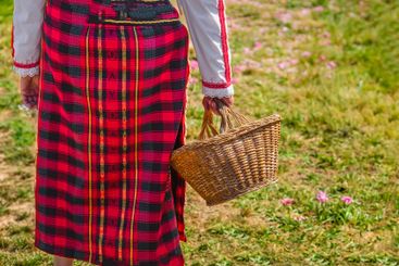 Traditional Bulgarian woman in a red folk costume...
