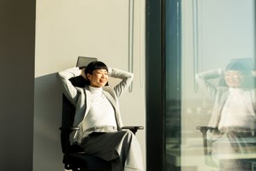 Relaxing in the sunlight while enjoying a moment of...