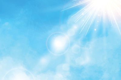 White cloud detail in blue sky with sunshine...