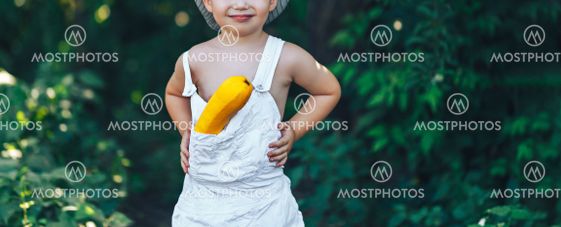 small kid farmer wearing in white clothes laughing with...