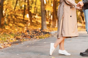 Cropped romantic photo of two lovers cuddling on forest...