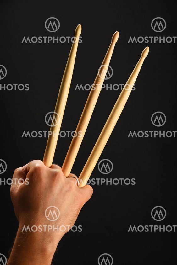 Wolverine hand with three drumsticks over black