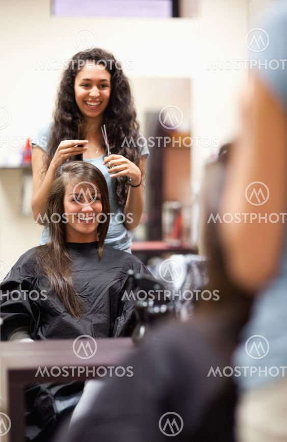 Portrait of a woman making a haircut