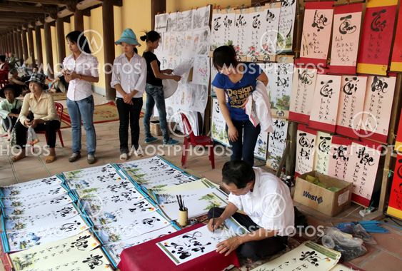 calligraphers writing the art letters