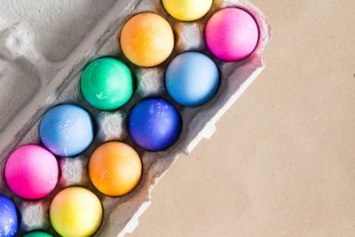 Vibrant hand dyed colorful Easter eggs in a box