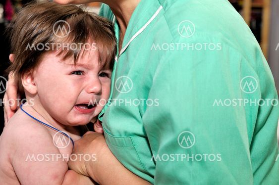 Baby cry on doctor hands