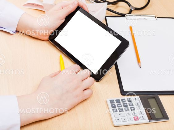 doctor read from tablet pc with cut out screen