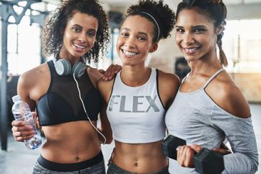 Happy women, portrait and fitness with friends at gym...