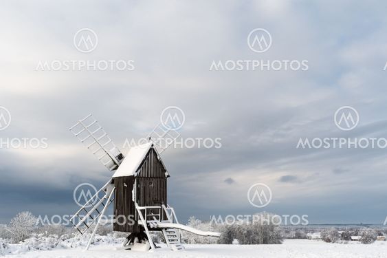 Old windmill in a snowy landscape