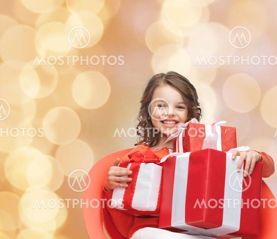 smiling little girl with gift boxes