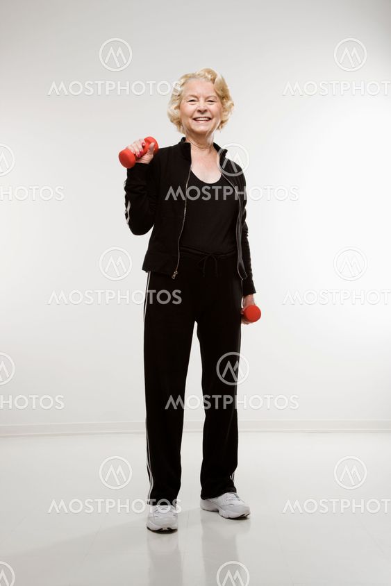 Woman holding weights.