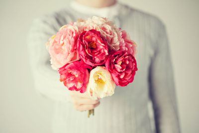 man giving bouquet of flowers