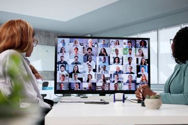 Female professional wearing mask leads medical conference
