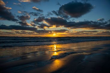 Evening landscape of sea water waves crushing on sandy...