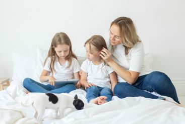 Cute family relaxing on the couch together at home