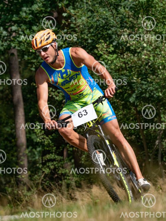 The competitor turns and tilts the center of gravity of...