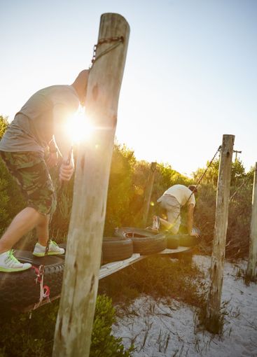 Outdoor obstacles, active or men climbing for strength,...