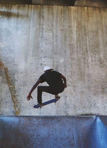 Jump, skateboard and balance with man at park for urban,...