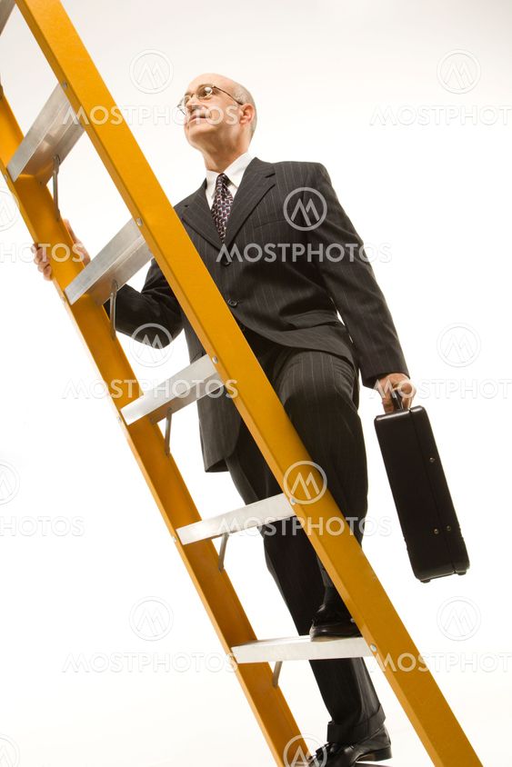 Businessman climbing ladder.