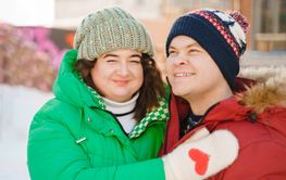 Winter plus size couple lovestory. Happy smiling man,...
