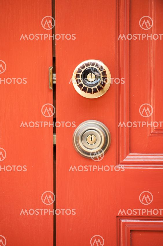 modren style door handle on natural wooden door