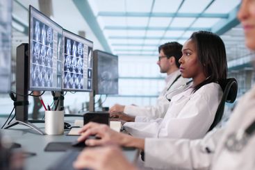 Medical Team Analyzing Brain MRI Scan