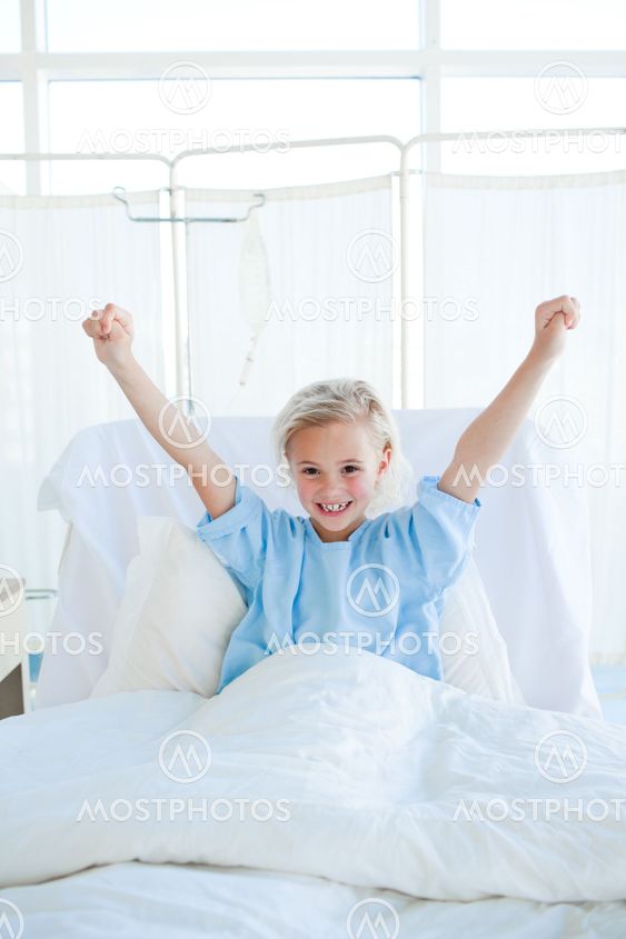 Happy child patient punching the air