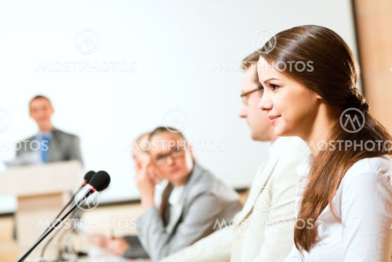 businessmen communicate at the conference